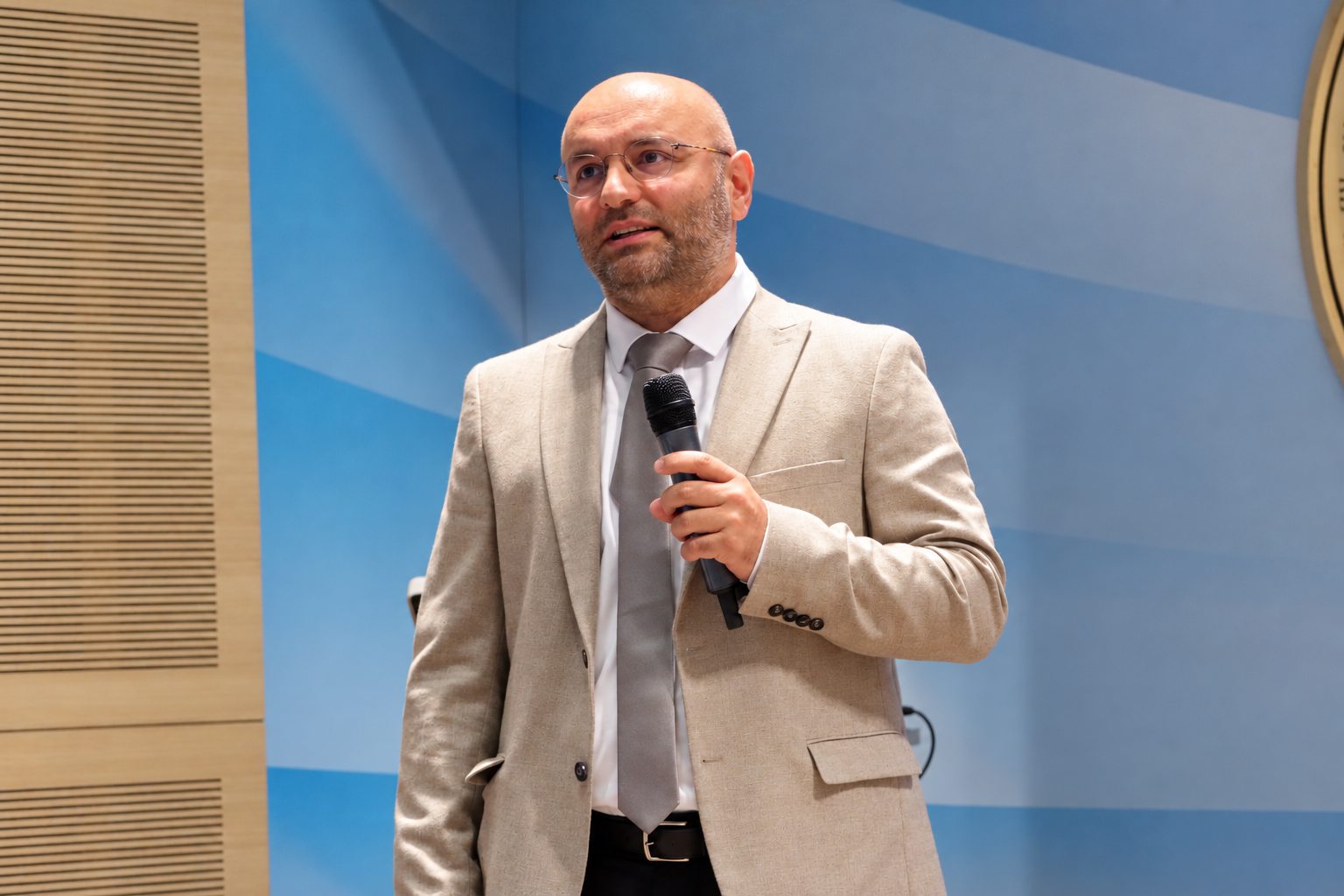 Man speaking into a microphone
