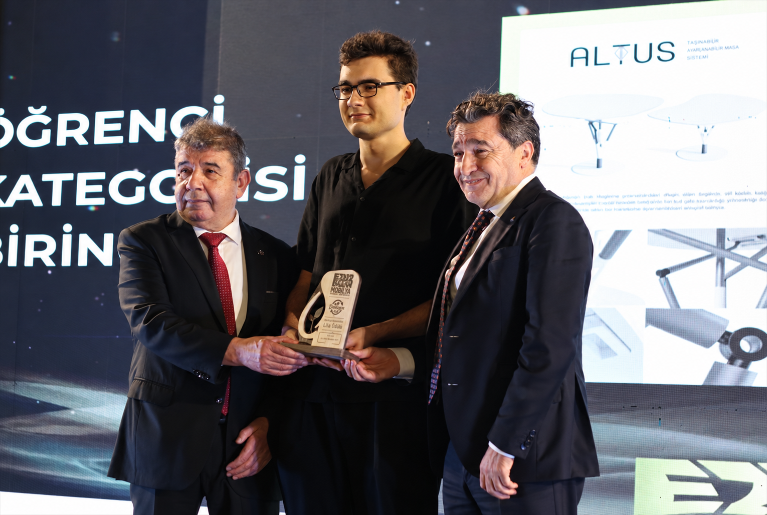 Three person awards ceremony portrait