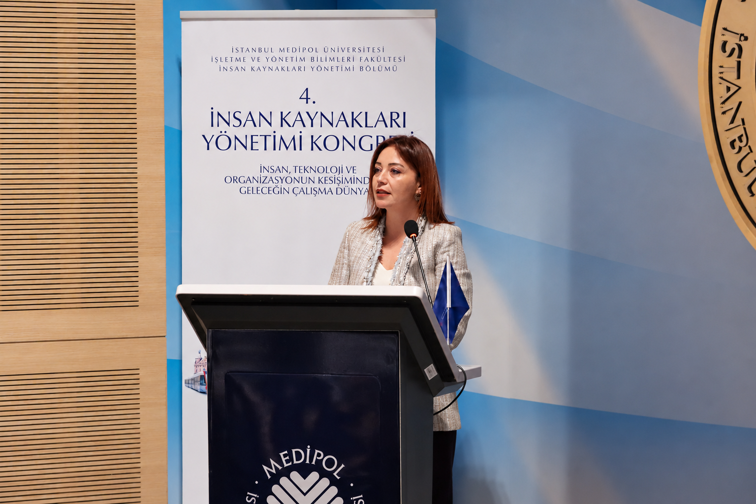 Woman speaking at university podium